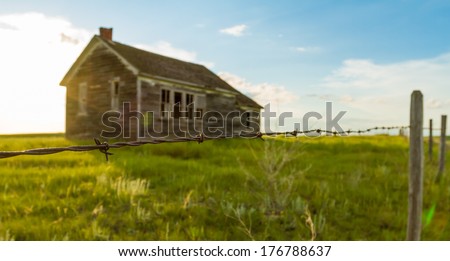An Old Abandoned One Room School House On The Prairies