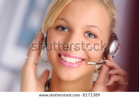 young pretty sexy blond hair operator with headset