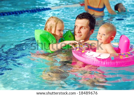 With the father in the swimming pool