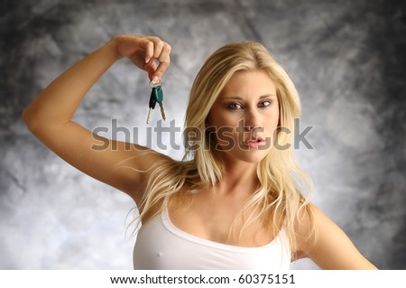 Blond woman with the key in a white undershirt