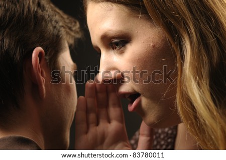 Woman whisper in ear man