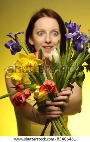 Portrait of pretty girl with a bunch of flowers
