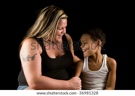 stock photo : Mother and seven-year old son enjoy a laugh; working-