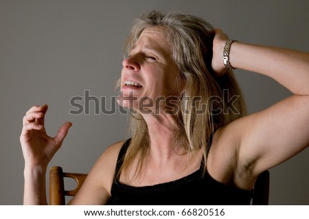 woman screaming and raging, suffering in pain and anger