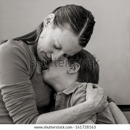 Mother comforting her crying 6 year-old son