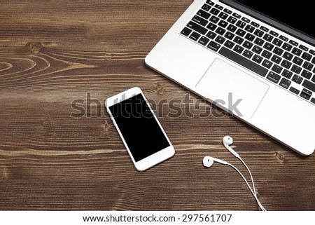 Mobile phone and laptop on the table