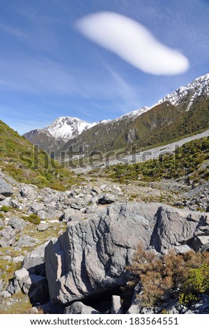 Natural cloud on the Hooker Valley track from Mount Sefton & Mount Cook looking towards the hermitage in Mount Cook National Park, New Zealand