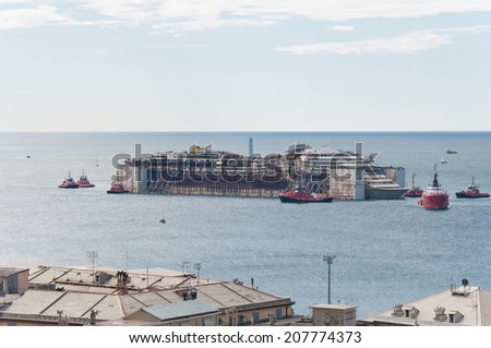 GENOA, ITALY - JULY 27: Costa Concordia wreck enters Genoa port for scrapping on July 27, 2014  in Genoa, Italy