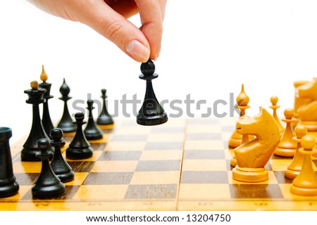 Chess-player making a move on a chessboard
