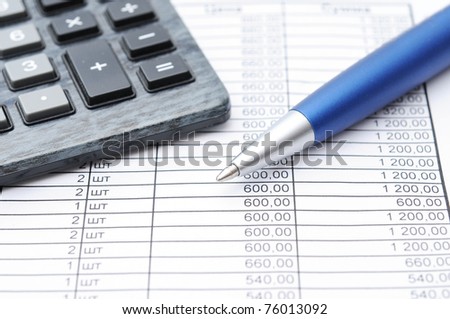 Financial paper, pen and calculator