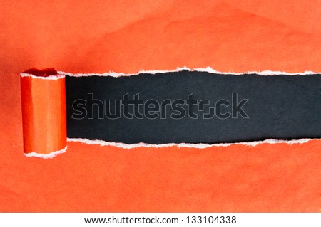 Torn paper with opening showing black background
