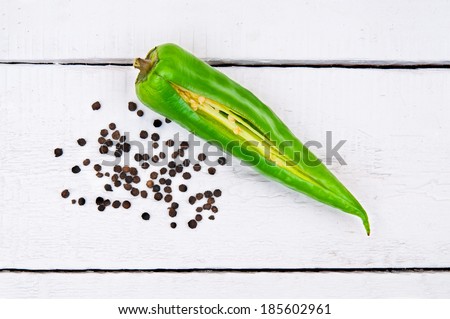 Cut green pepper and peppercorns
