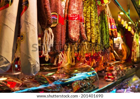 BARCELONA, SPAIN - JUNE 16, 2014: Smoked sausage at Boqueria market. The market is famous for its variety of fresh produce