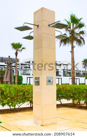 AGADIR, MOROCCO - JUL 09, 2014: Beach shower at  Hotel Sofitel Agadir Royalbay Resort is located in the magnificent beach of Atlantic ocean with golden sand and imbued  the spirit of modern luxury