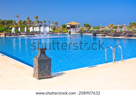 AGADIR, MOROCCO - JUL 04, 2014: Swimming pool  Hotel Sofitel Agadir Royalbay Resort is located in the magnificent beach of Atlantic ocean with golden sand and imbued  the spirit of modern luxury