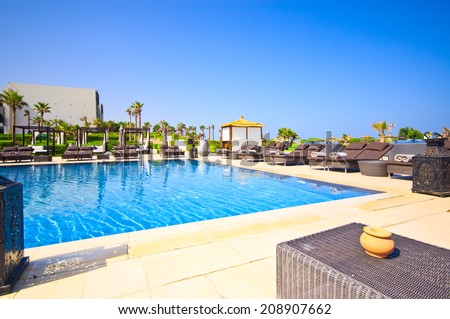 AGADIR, MOROCCO - JUL 08, 2014: Swimming pool  Hotel Sofitel Agadir Royalbay Resort is located in the magnificent beach of Atlantic ocean with golden sand and imbued  the spirit of modern luxury