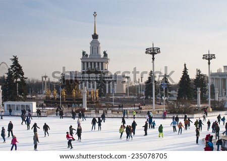 MOSCOW, RUSSIA - NOVEMBER 29, 2014: People at Skating rink on VDNKh (All-Russia Exhibition Centre), Moscow, Russia. It  is the largest ice rink in the world