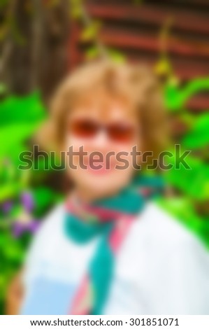 Blur portrait senior woman in garden