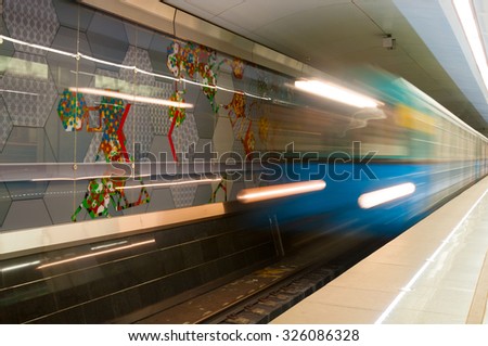 MOSCOW, RUSSIA - OCTOBER 06, 2015: Arriving subway train at metro station Spartak in Moscow, Russia. Spartak was opened  August 27, 2014.