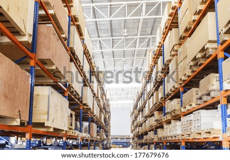 Shelves with boxes in factory warehouse