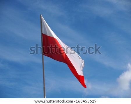 polish flag on a pole over beautiful sky, Poland