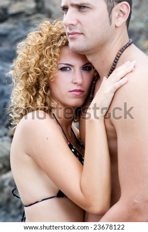 male and female model on the beach