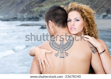 male and female model on the beach