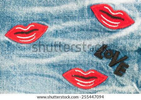 Blue jeans with lip and love word