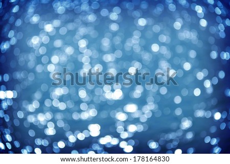 blue bokeh background of Light shining on the river, Abstract river shot in manual mode out of focus.