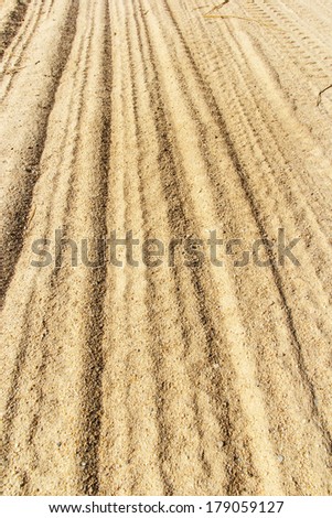 sand backgrounds and texture, Wheel tracks in the sand backgrounds and texture .