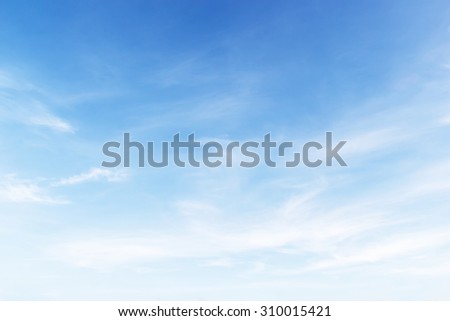 Fantastic soft white clouds against blue sky background, soft focus.