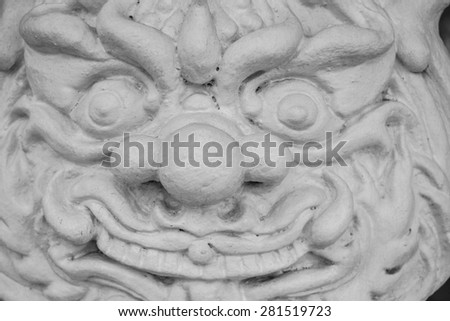 Face terrible god. Stone sculpture. Thailand, Chiang Mai. White temple.