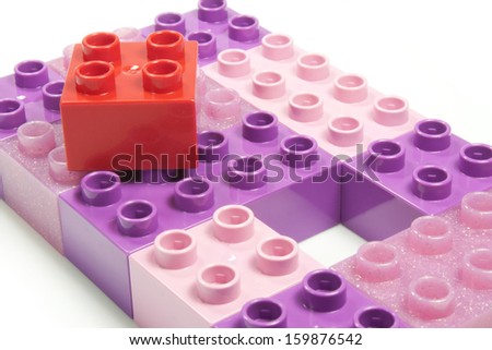 toy bricks of different colors joined together
