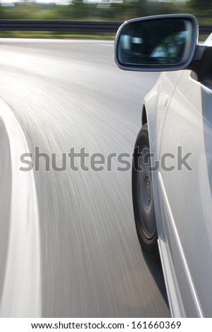 car at high speed while cornering