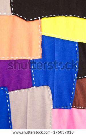 Multi-colored fabric sewn into the same sheet.