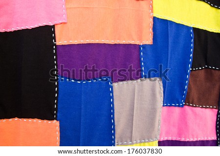 Multi-colored fabric sewn into the same sheet.