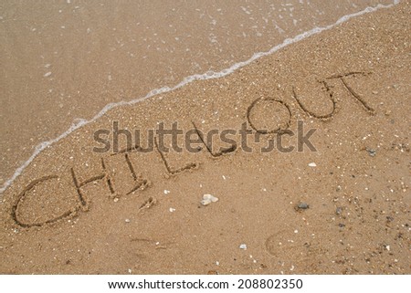 text Chill out on the sandy beach.
