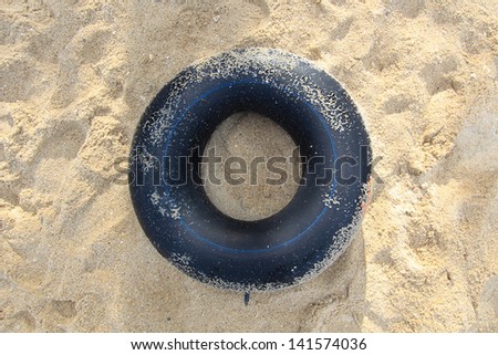 black Ring buoy help swim on ocean beach