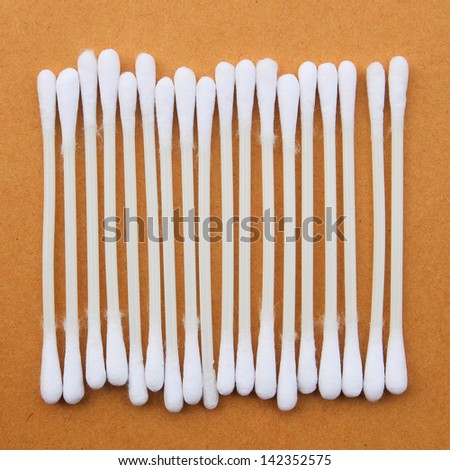 clean cotton bud on brown paper background