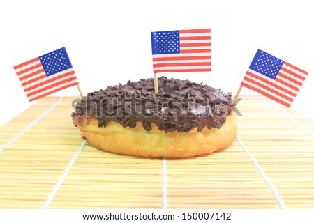 Chocolate glazed donut and country flag