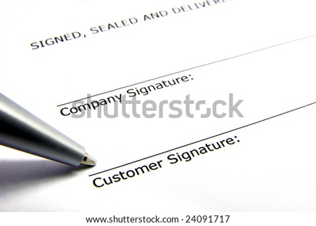 View of a signature box of a contract with a pen.