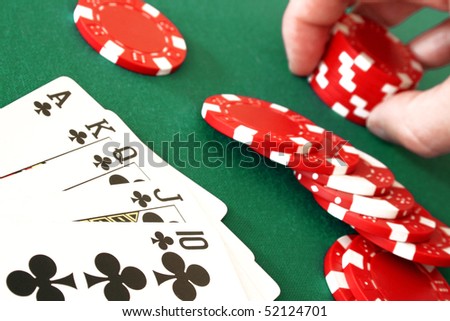 Detail view of a royal flush combination at poker with chips