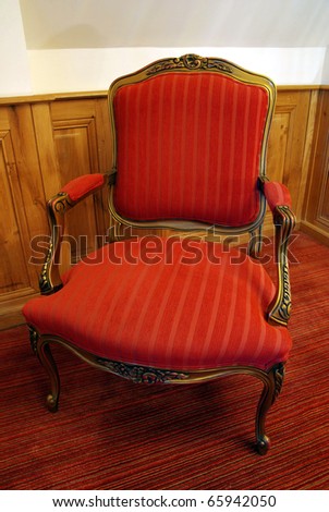 Image of a nice antique chair in a room.