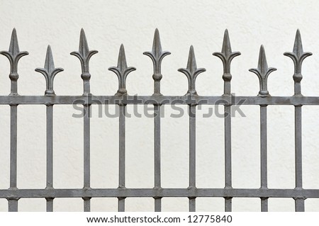 Wrought iron fence with decorative arrows