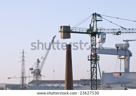 Cranes, chimney, factories, high voltage pylons: different kind of industries