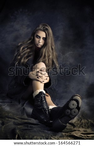 photo session in studio of the young girl in style art with an unusual makeup