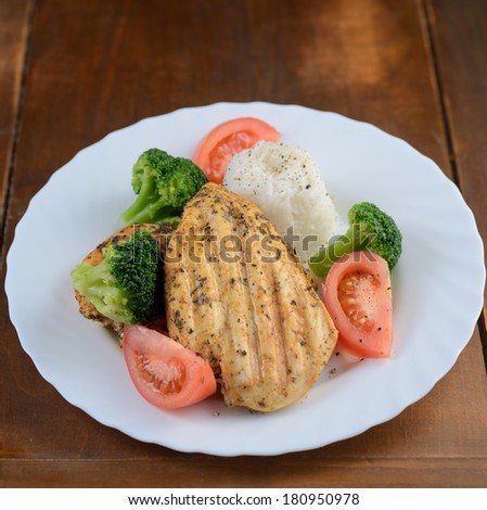 grilled chicken breast with rice and vegetables