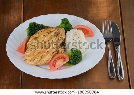 grilled chicken breast with rice and vegetables