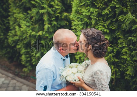 gentle kiss bride in the park
