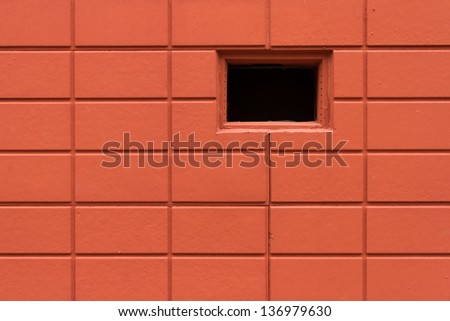 Red brick pattern textured background and a window hole.